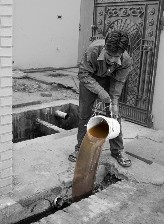 Raw sewage water from septic tank being disposed into stormwater drain outside the house in Bareilly, Uttar Pradesh